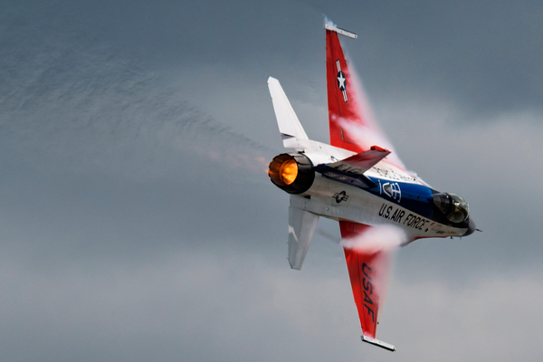 A United States Air Force F-16 Viper races across the sky afterburner ablaze Print