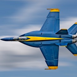 US Navy F-18 Super Hornet of the Blue Angels races across the sky