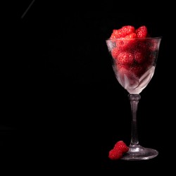 Raspberries in a Wine Glass